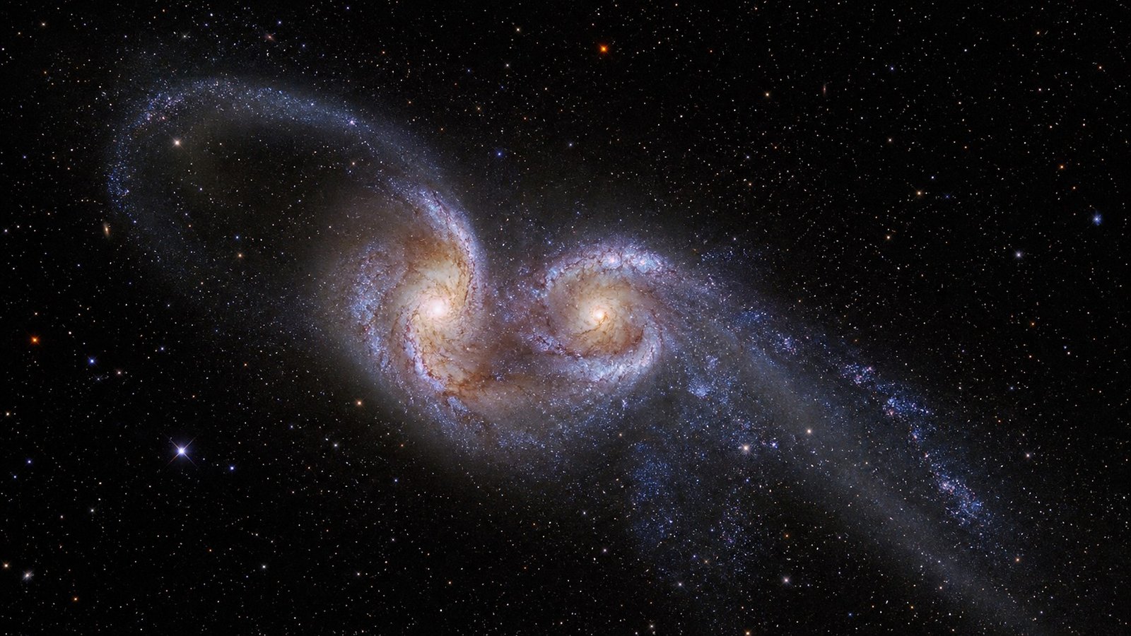 Le galassie a doppia coda: cosa succede quando due galassie collidono