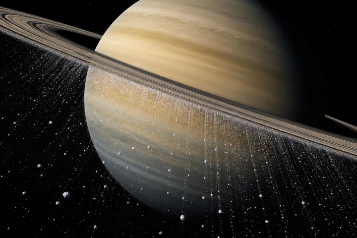 Diagramma scientifico della pioggia di particelle di ghiaccio che cade dagli anelli di Saturno verso l'atmosfera del pianeta